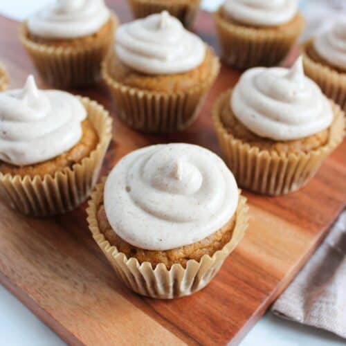 Soft Gluten Free Pumpkin Cupcakes on a wood tray