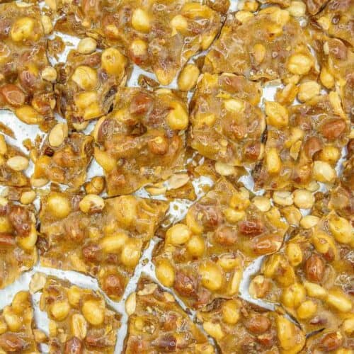 Gluten Free Peanut Brittle on a baking sheet broken