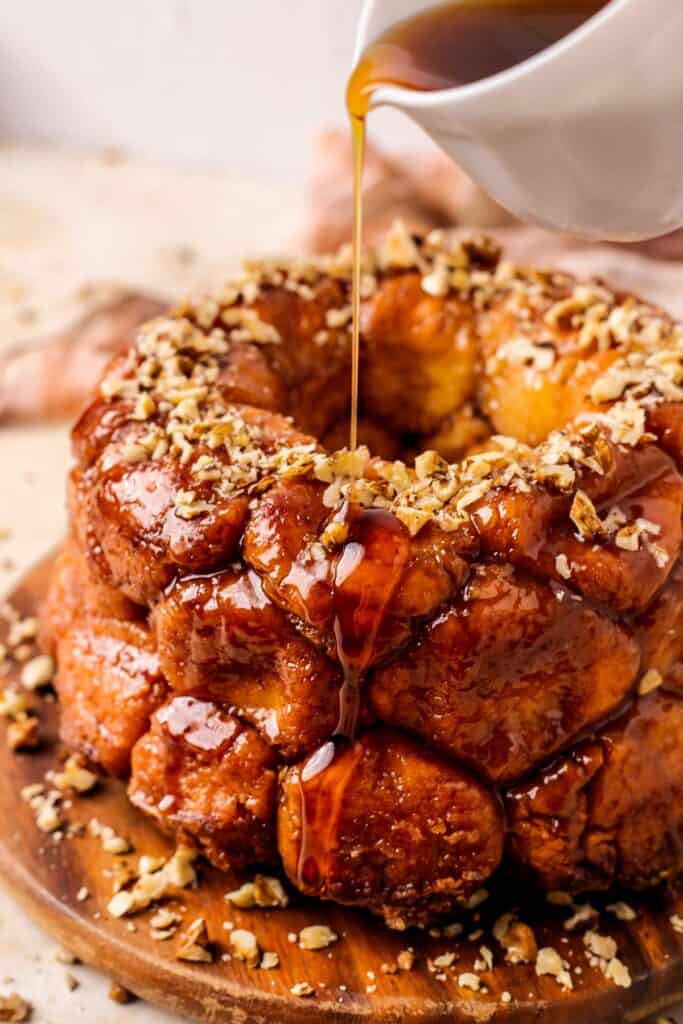 gluten free monkey bread with syrup drizzling over top