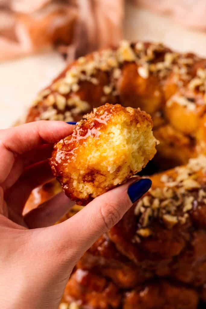 gluten free monkey bread being held in fingers