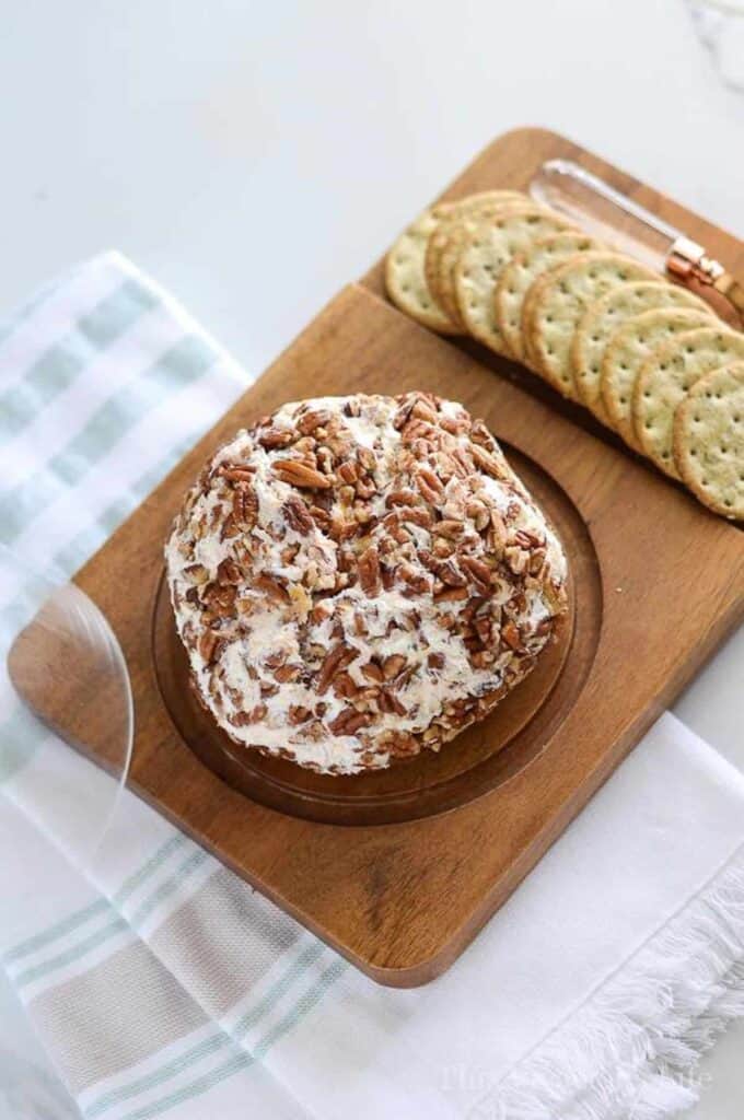 crackers on a tray with a cheeseball