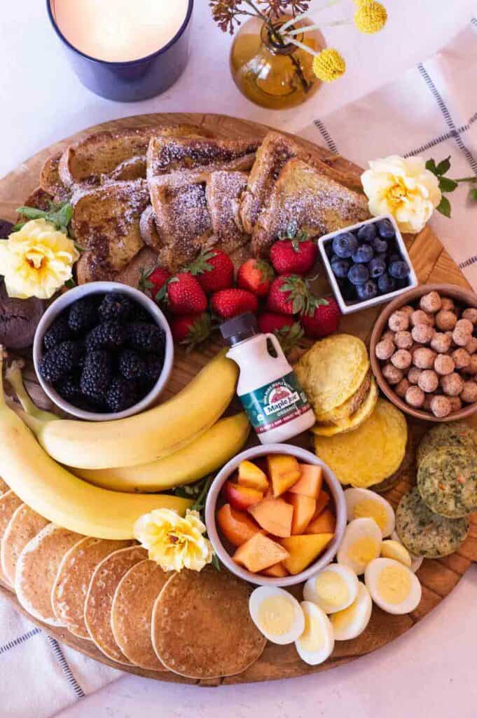 Breakfast Charcuterie Board with French toast, pancakes, fruit and more.