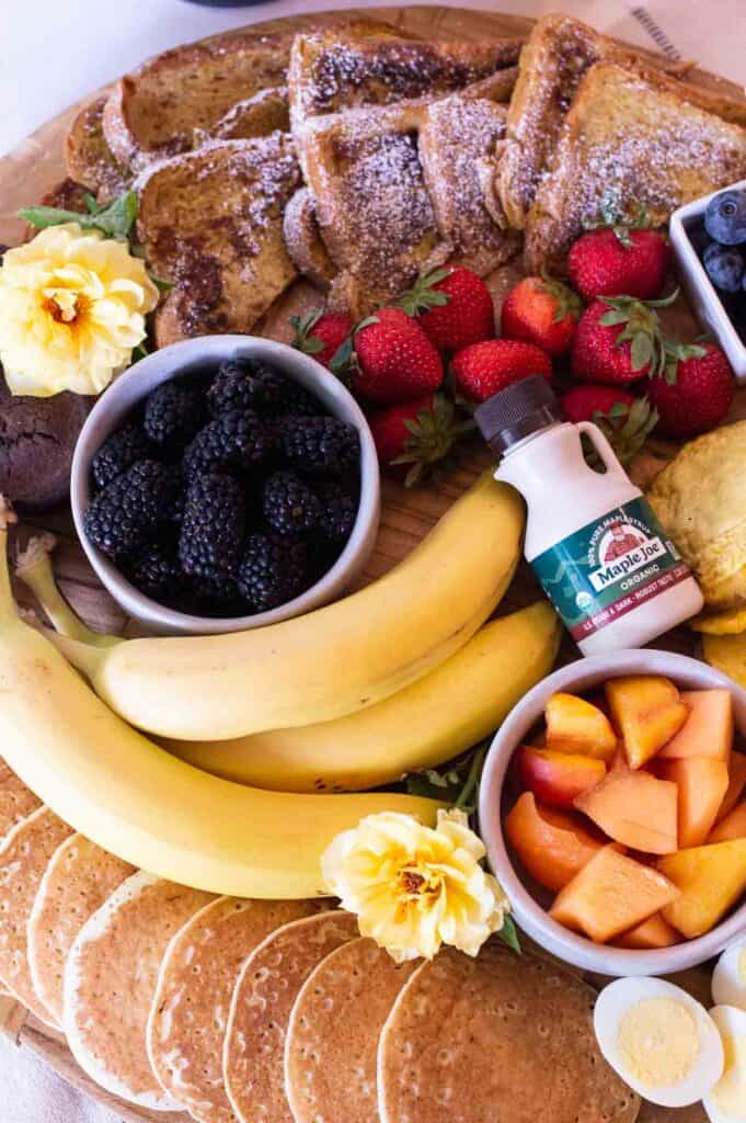 Breakfast Charcuterie Board with blueberries, strawberries, bananas and more.