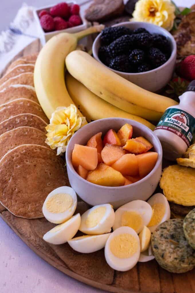 Breakfast Charcuterie Board with pancakes, bananas, eggs and cantaloupe