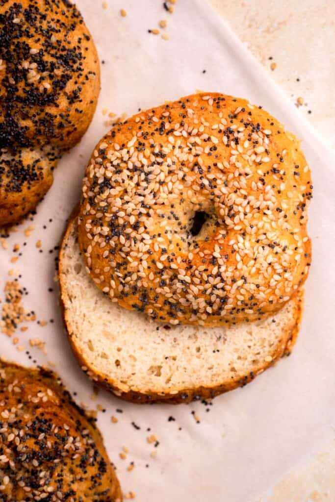 Gluten Free Bagels cut in half with seeds on top